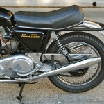 Norton Commando - 1974 - Chain Guard, Rear Shock, Seat, Footrest Plate, Chain and Sprocket.