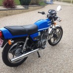 Suzuki GT250X7 - 1979 - Exhaust Pipe, Tail Piece, Rear Shock Absorber and Flasher.