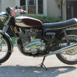 Triumph Trident T160 - 1975 - Left Side View, Triumph Tank Badge, Chain Guard, Forks and Front Fender.
