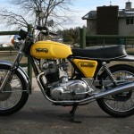 Norton Commando -1975 - Tank, Exhausts, Silencer, Primary Chain Cover, Wheels and Tyres.