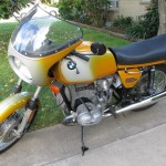 BMW R90S - 1975 - Left Side View, Fairing, Screen, Side Stand, BMW Badge, Mirror, Fender and Wheels.