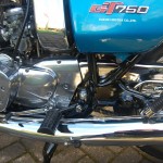 Suzuki GT750 - 1976 - Chain Cover, Chain Guard, Footrest, Air Filter Side Cover and Gear Lever.